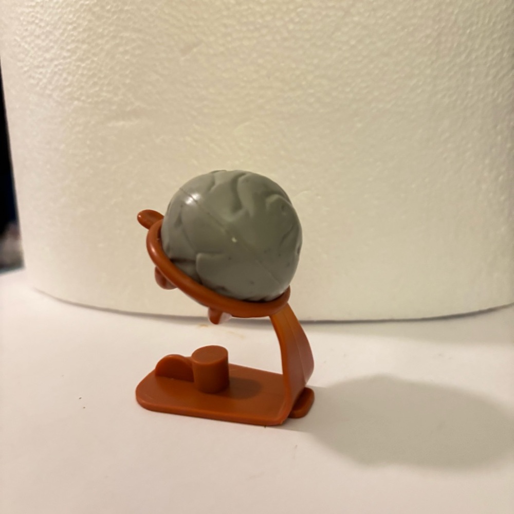 Bakugan
Battle Brawlers grey brain sphere that sits on a sling shot stand